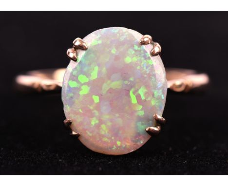 Opal dress ring, oval cabochon cut opal, measuring 13 x 11mm, claw set in 9 ct mount, ring size QCondition Report:  Gross wei