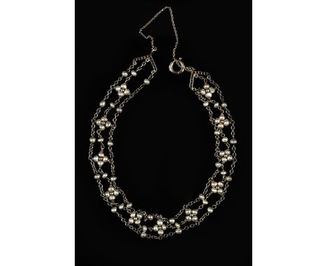 Seed pearl and rose cut diamond bracelet, three rows of cable chain intermittently set with floral motifs comprised of seed p
