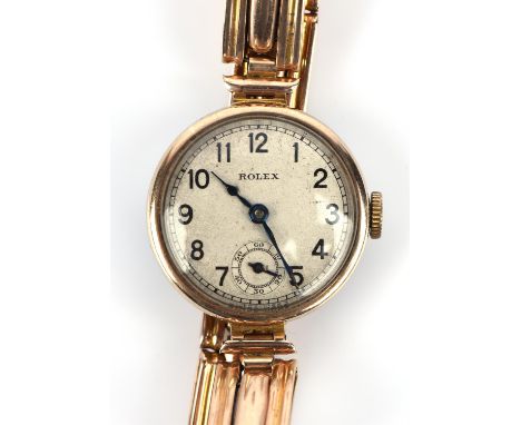Rolex,A Ladies gold wristwatch the signed dial with Arabic numeral hour markers within a railway minute  track, subsidiary se