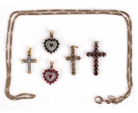 A selection of pendants, including a diamond cross pendant, in 18 ct on a 14 ct chain, together with another cross in 14 ct, 