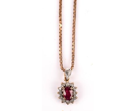 Ruby and diamond cluster pendant, with central oval cut ruby surrounded by single cut diamonds, mounted in 18 ct, on a box li