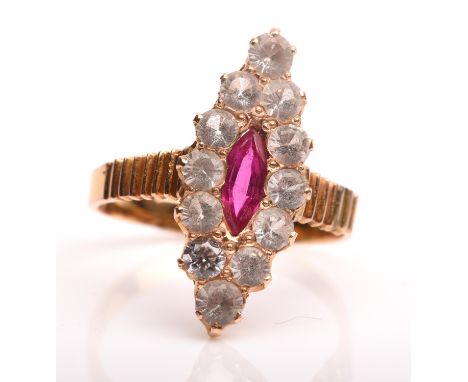 Sapphire and ruby navette ring, with central marquise cut ruby with a surround of round cut white sapphires, with textured sh