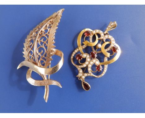 A garnet &amp; pearl set 9ct gold pendant, 2" overall and a 9ct gold leaf brooch (2)