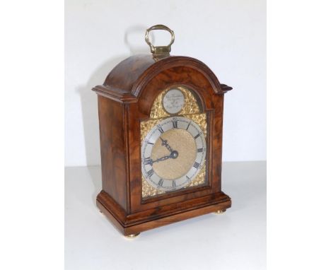 A small early 20thC walnut bracket clock by Charles Frodsham 'Clockmaker to H M George VI',  arched brass dial with silvered 