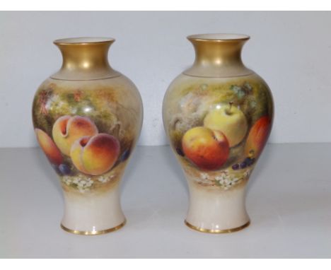 A pair of Royal Worcester vases painted still life fruit by William Ricketts, 5.9" high - chip to one footrim.  (2)