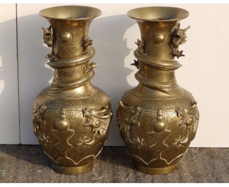 A pair of 20thC Chinese brass vases, having applied &amp; raised dragon decoration, ornate cast seal marks to bases, 16.5" hi