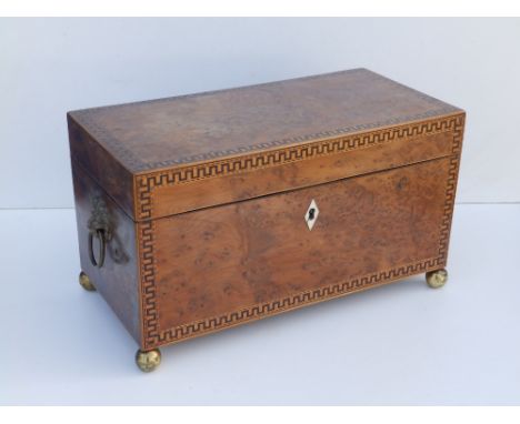 A 19thC burr yew tea caddy.