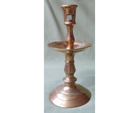 An early brass heemskerk candlestick, the socket with two rectangular apertures, 8" high.