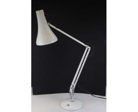A white angle poise lamp marked Anglepoise Ltd. 