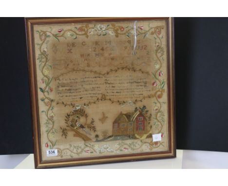 19th century Silk Needlework Sampler including the alphabet, numbers, verse, house and a bird in a tree, all within a scrolli