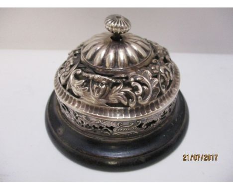 A late Victorian silver reception bell by William Comyns and Sons, London 1900 with a rotating finial, floral and scrolled, e