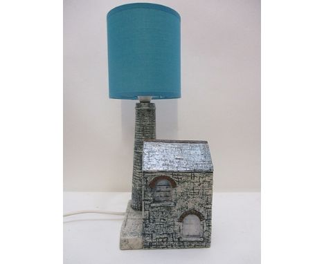 A Troika pottery lamp by Jane Fitzgerald fashioned as a tin mine, decorated in blue and brown, 8 1/2 h