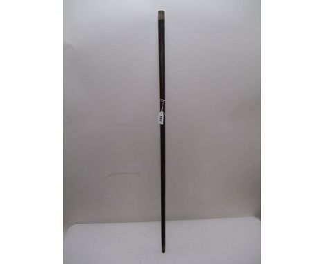 An early 20th century exotic hardwood walking stick with a white metal cap handle, on a tapered shaft, length 34