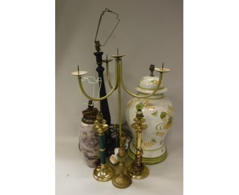 A pair of modern painted metal four light three branch pricket candlesticks, a pair of lacquered brass candlestick type lamps