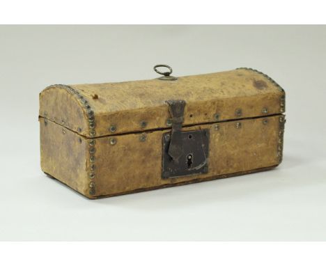 An early 19th Century miniature studded leather covered dome top trunk with paper-lined interior, 27 cm wide x 12 cm high