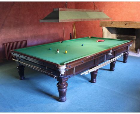 A Burroughes and Watts full size snooker table mahogany framed with green baize, together with accessories including overhead