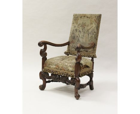 A 19th Century Continental walnut framed hall chair in the circa 1700 Flemish manner, the tapestry upholstered back decorated