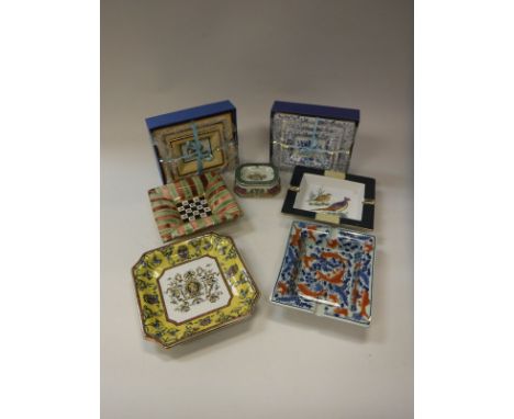 Three boxed sets of three modern graduated ashtrays, one with blue and white floral transfer decoration, one with bird decora
