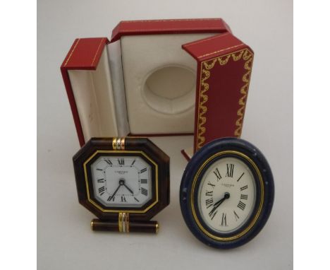 A Cartier travel clock of octagonal form, set with yellow, white and rose gold effect mounts,  the white enamel dial set with