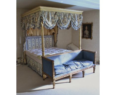 A modern full tester four-poster bedstead in the Regency style with cream painted floral spray decoration, together with chin