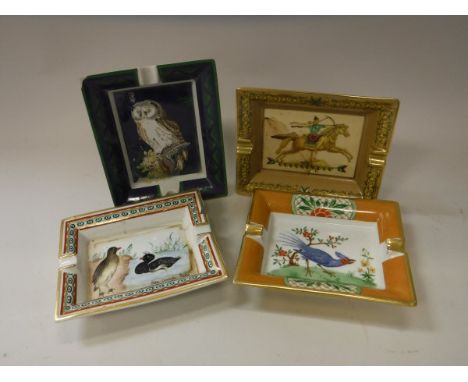 Two Hermes ashtrays, each depicting birds with gilt decoration, 19.5 cm long, another with archer on horseback, 20 cm long an
