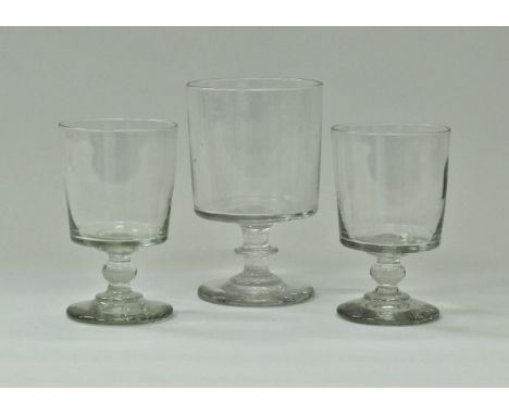 An early 19th Century rummer of plain form straight sided bucket form, raised on a knop stem to stepped circular foot, 12.5 c