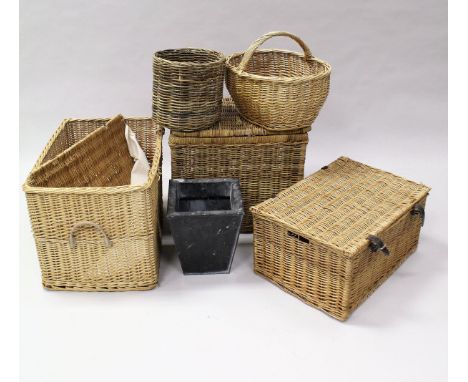 A collection of various wicker baskets, a large metal tub and a square metal planter