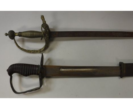 A Spanish dress sword with ornate knuckle guard, the scrolling foliate decorated blade inscribed "Fabrica de Toledo 1871", 84