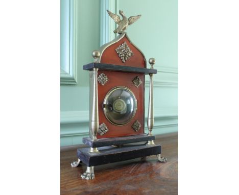 A late 19th Century Continental Empire style watch stand with fob watch and a miniature brass lantern style mantel clock insc