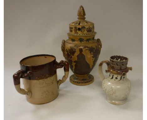 A 19th Century stoneware puzzle jug with applied countryside scenes, 16.5 cm high, together with a Victorian pottery decoupag