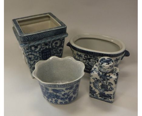 A pair of modern Chinese style blue and white square tapering jardiniers raised on bracket feet, approx 22.5 cm high, togethe