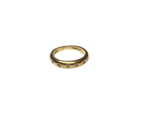 18ct gold ring with a diamond set band (London 1994), size I½Weight 3.1 grams