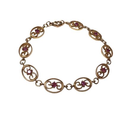 9ct gold and ruby bracelet with nine oval panels each set with a round mixed cut ruby, 18.5cm longWeight 8.3 grams