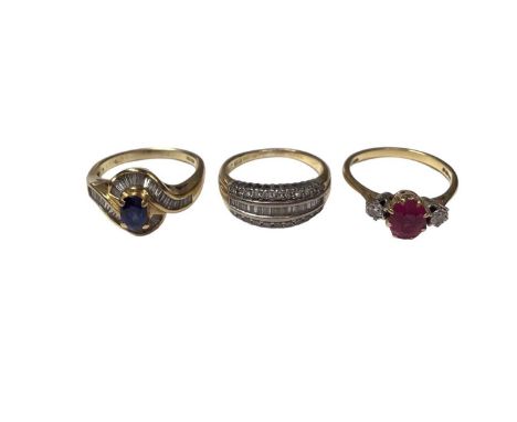 Three 18ct gold diamond and gem set rings to include a three row diamond set band, size N½, sapphire and diamond cross over r