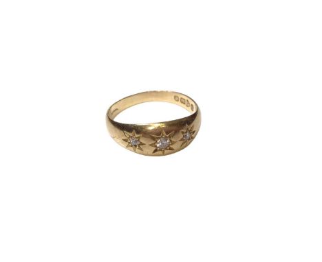 Diamond three stone gypsy ring with a central old cut diamond flaked by two rose cut diamonds in 18ct gold setting (Chester 1