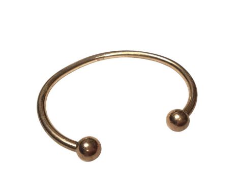 9ct gold torque bangle with ball terminals (Sheffield hallmarks)Weight 23.5 grams
