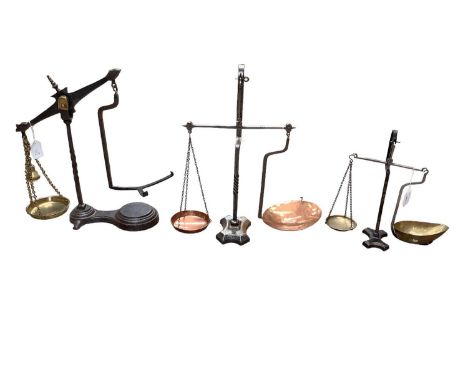 Three sets of Victorian iron, brass and copper scales, including two with twisted columns, the other by Avery