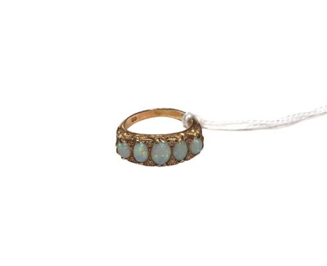Victorian style opal five stone ring with five graduated oval cabochon opals in carved scroll setting with diamond accents on