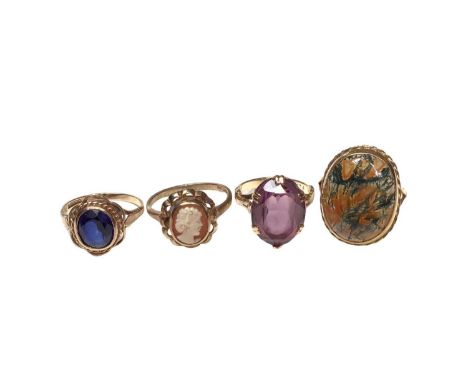 9ct gold oval moss agate ring, 9ct gold carved cameo ring and two other 9ct gold gem set rings (4)Total weight 13.8 grams