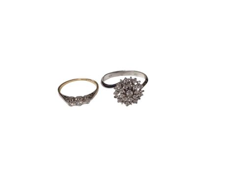 18ct gold diamond three stone ring, size I½ and 18ct white gold synthetic white stone cluster ring, size Q (2)Total weight 4.