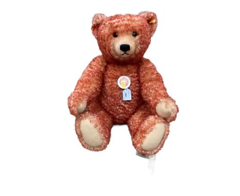 Large Steiff 000218 Bear with swing tag on chair together with a green Steiff bear 408540 (boxed and certificate) and a red a