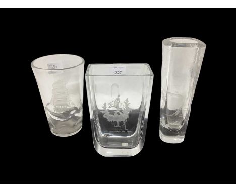 Three mid century Orrefors glass vases with etched decoration, one with galleon, one with tree and one with figures, all sign