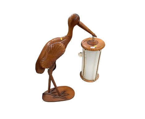 Unusual free standing lamp in the form of a stork, holding a lantern in its beak, 100cm in overall height.