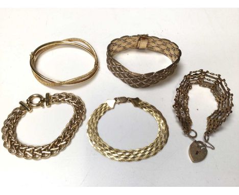 9ct gold gate bracelet with padlock clasp, three 9ct gold woven link bracelets and a 9ct gold hinged double bangle (5)Total w