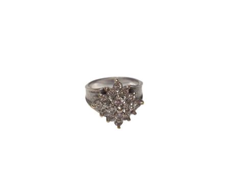 Diamond cluster ring with sixteen brilliant cut diamonds in a tiered claw setting on precious white metal shank, tests as app
