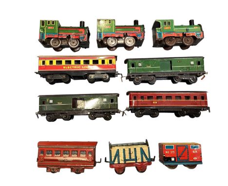 Tin plate collection of model railway, possibly Wells Brimtoy, to include locomotives, carriages, wagons and track.