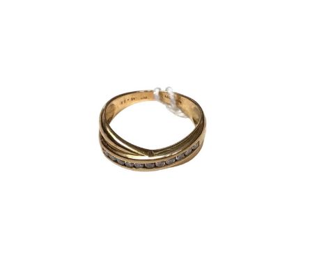 18ct gold diamond set cross over band ring with a row of eleven brilliant cut diamonds, estimated to weigh approximately 0.25