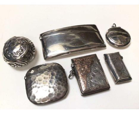 George V silver card case of curved form, (Birmingham 1919), together with a two silver vesta cases, a German silver vesta ca