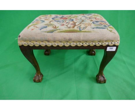 Foot stool on ball and claw feet with tapestry upholstery 