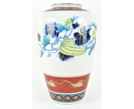 A Japanese Meiji period Imari porcelain vase. The elongated ovoid shaped vase having a short neck with everted rim, geometric